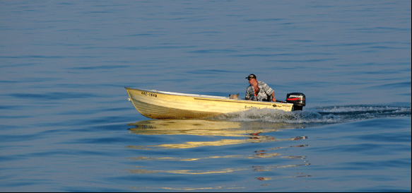 photograph of man in boat off of Port Ryerse, on the Gold Coast of Ontario, on Lake Erie