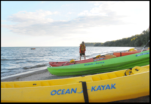  photograph of kayaks on the beach  in Port Ryerse, on the Gold Coast of Ontario, on Lake Erie